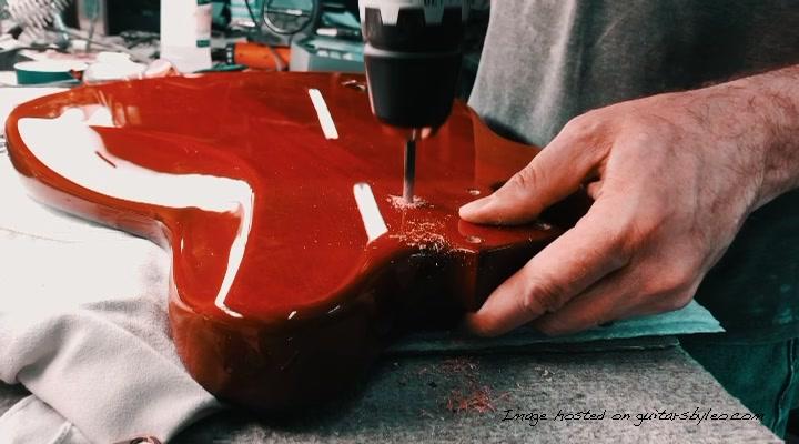 Ed hand drilling neck plate screw holes on a 40th Anniversary CLF Research Espada.