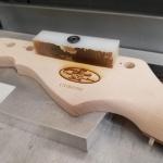 Jake's Custom Shop Legacy neck being laser engraved and serialized