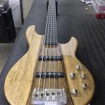 Fretless MJ-5 in Natural Gloss over black limba on swamp ash ebony board with white ghost lines