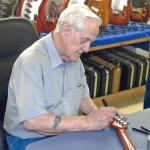 George Fullerton signing this guitar