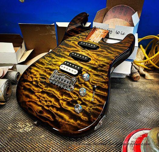 Custom Shop Legacy HSS RMC in Camo Burst over a 3A Quilted Maple top