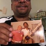 closeup holding the photo of Leo with Louis Johnson