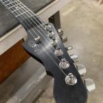 process known as “ebonizing” to turn the maple neck an even, deep black color-3