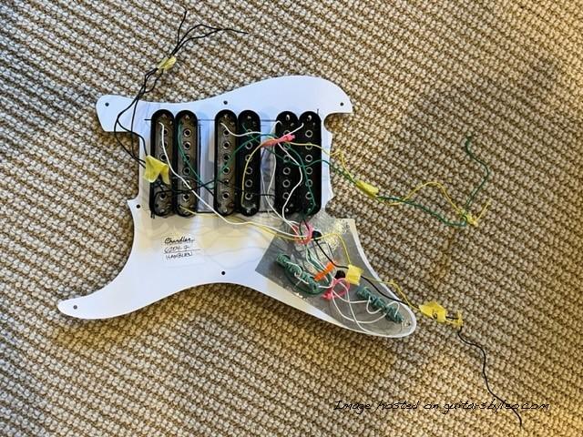 Back view of pickguard without potentiometers mounted Partially wired 