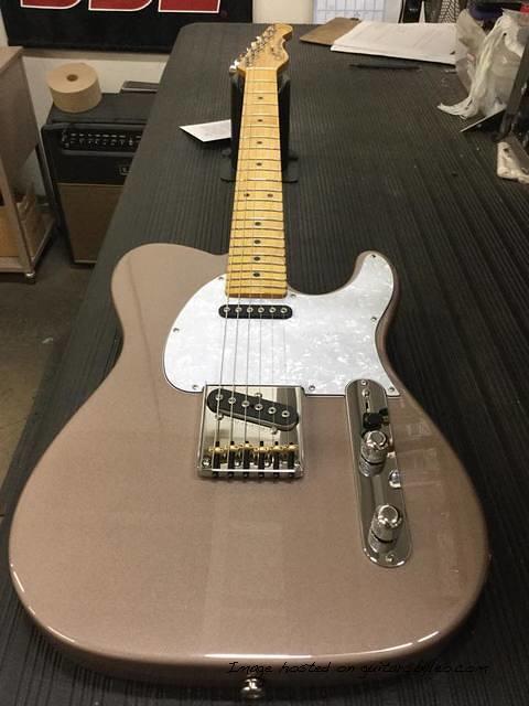 AC in shoreline gold with pearl guitar