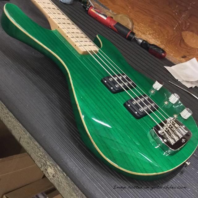 Here s an L-2000 in Clear Forest Green over empress wood binding quartersawn maple neck with Clear Satin finish matching 
