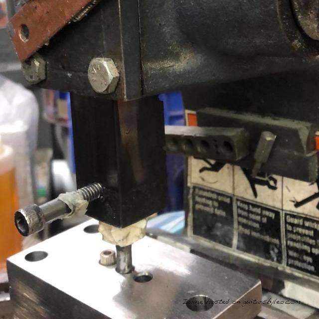 Norma is pressing the MFD pole piece bushings into the Espada fibers she prepared earlier-4 jpg
