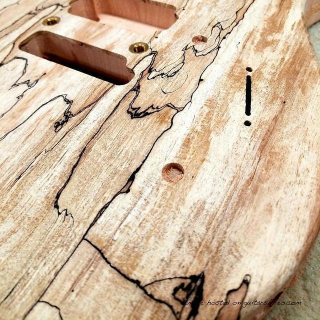 ASAT Deluxe has a Spalted Maple top over Okoume