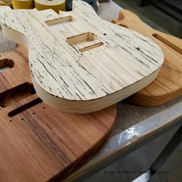 ASAT bodies in various exotic woods From left to right Guanacaste Spalted Maple top and Roasted Ash