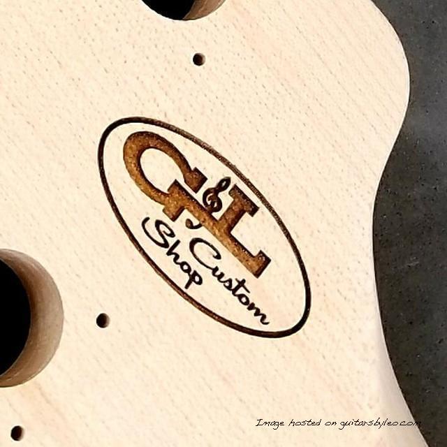 Closeup of laser etched G amp L Custom Shop logo