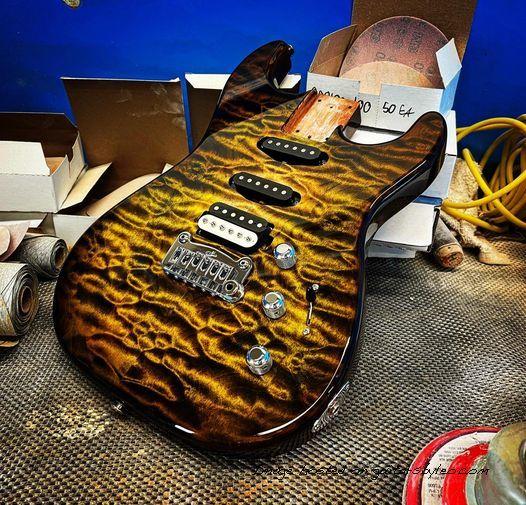 Custom Shop Legacy HSS RMC in Camo Burst over a 3A Quilted Maple top