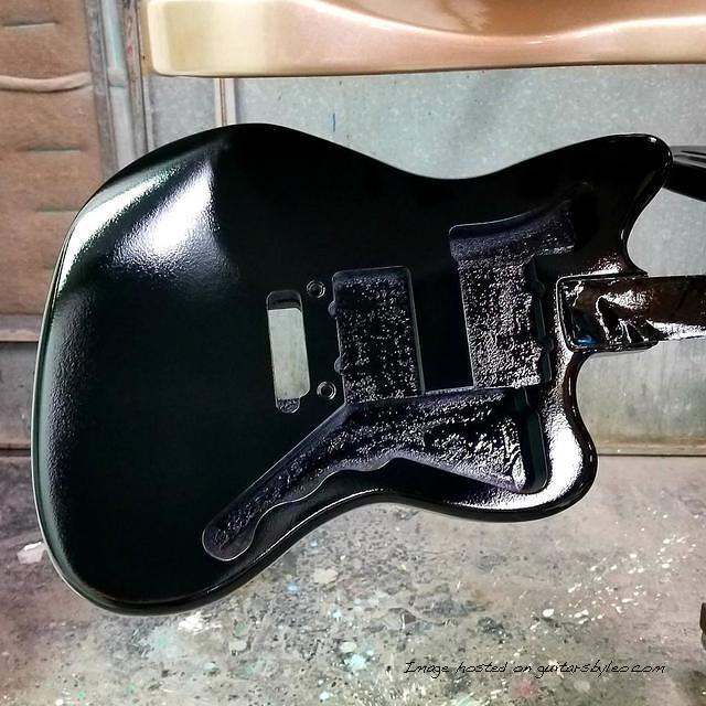 Laying down the clear top coat on this Doheny for artist Johnny Gomez