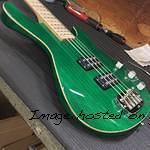 Here s an L-2000 in Clear Forest Green over empress wood binding quartersawn maple neck with Clear Satin finish matching 