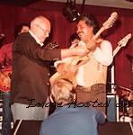 1982 - Leo Fender gives one of his new G amp L guitars to the legendary Freddy Fender