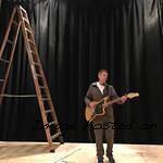 Down from the ladder after hanging the stage drape