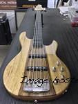 Fretless MJ-5 in Natural Gloss over black limba on swamp ash ebony board with white ghost lines