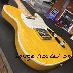 AC in Lemon Drop on Swamp Ash top white binding body close up