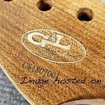 Closeup detail of a Roasted Maple neck with a Quilted Maple logo insert