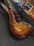 S-500 in Old School Tobacco Sunburst over flame maple on swamp ash body close up