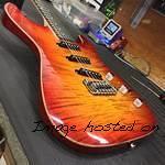 S-500 RMC in Cherryburst on flame maple top on swamp ash with wood binding