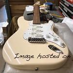 Tribute Series Comanche in Olympic White over mahogany matching headstock up top